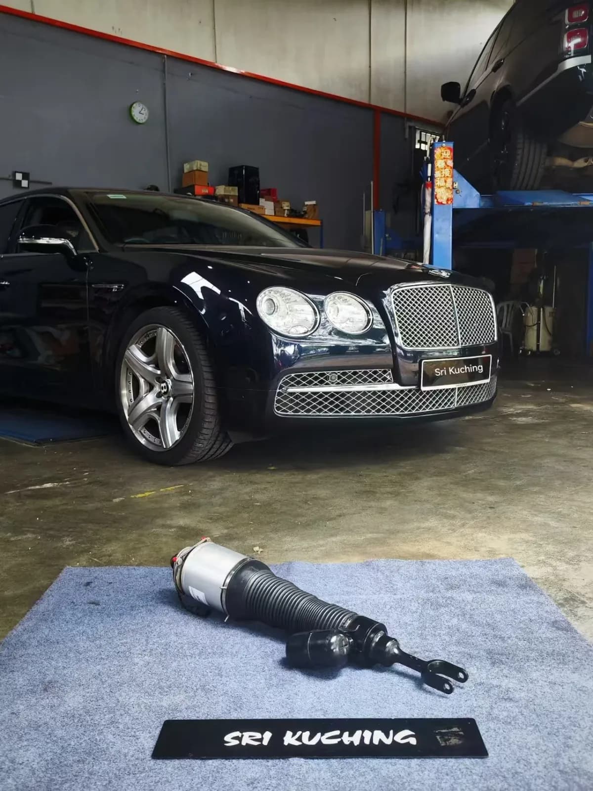 Bentley Continental Flying Spur at Sri Kuching with an air strut displayed in the foreground