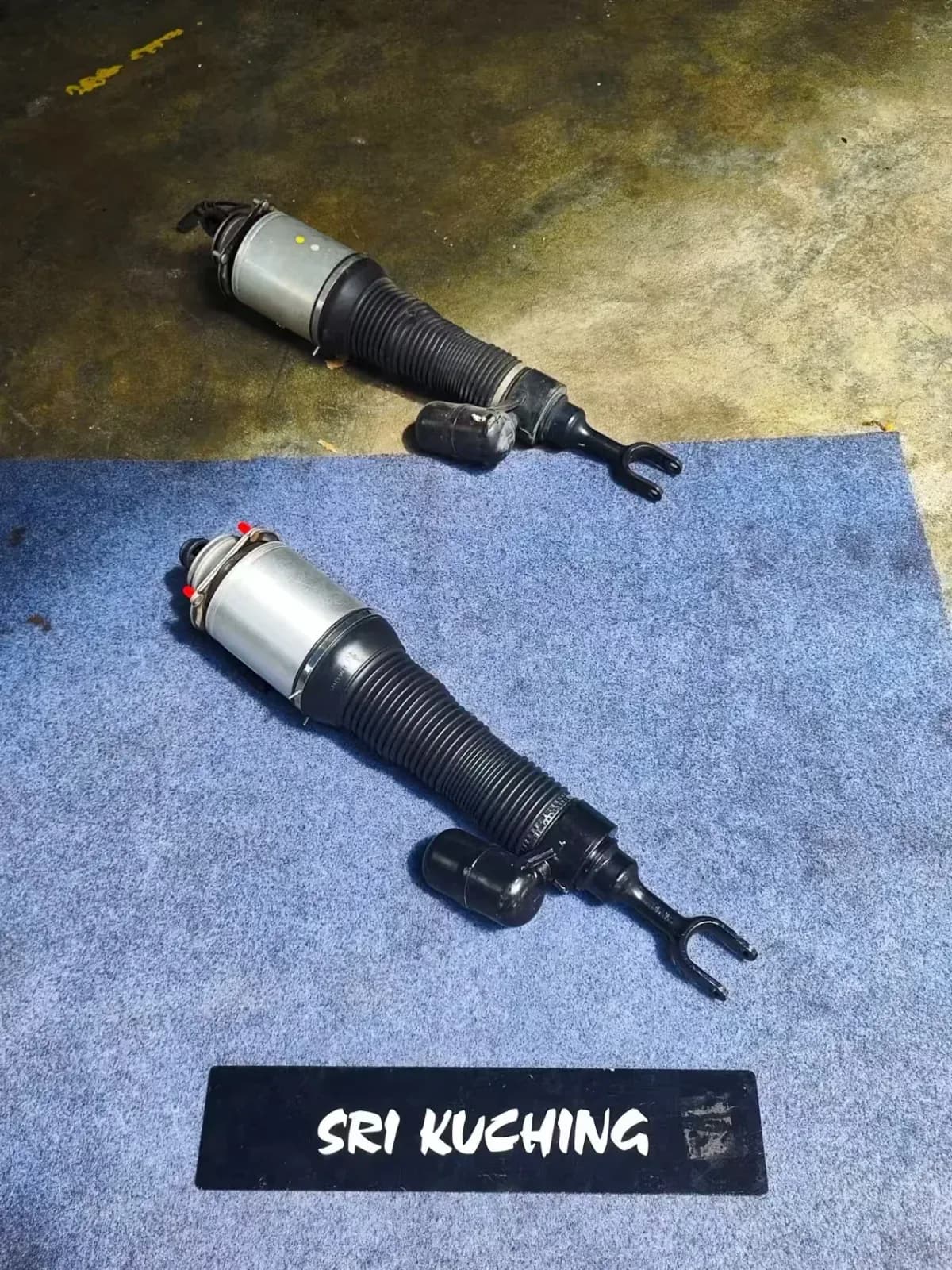 Two Bentley air strut assemblies photographed during the Continental Flying Spur repair