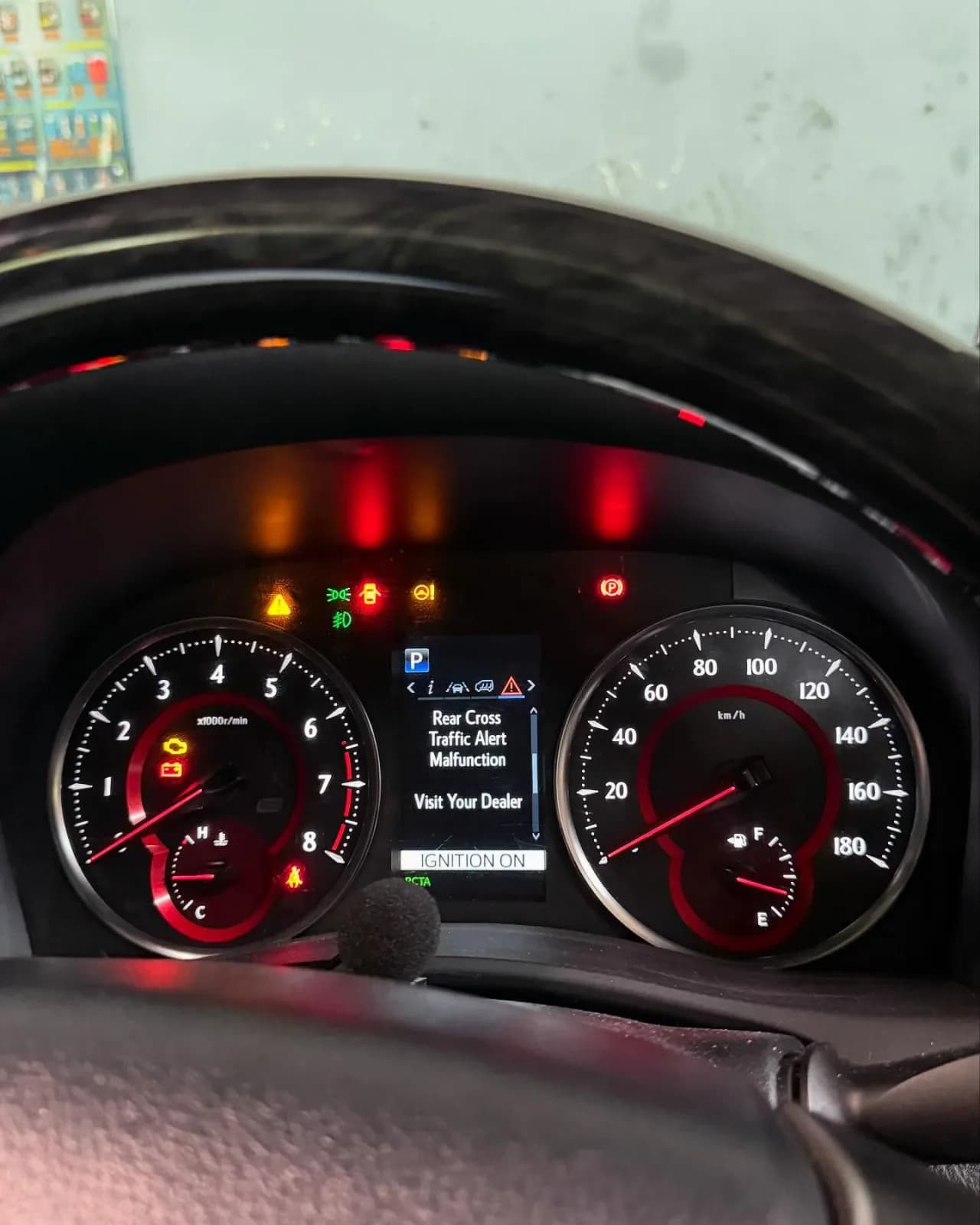Toyota Vellfire dashboard showing Rear Cross Traffic Alert Malfunction and Visit Your Dealer