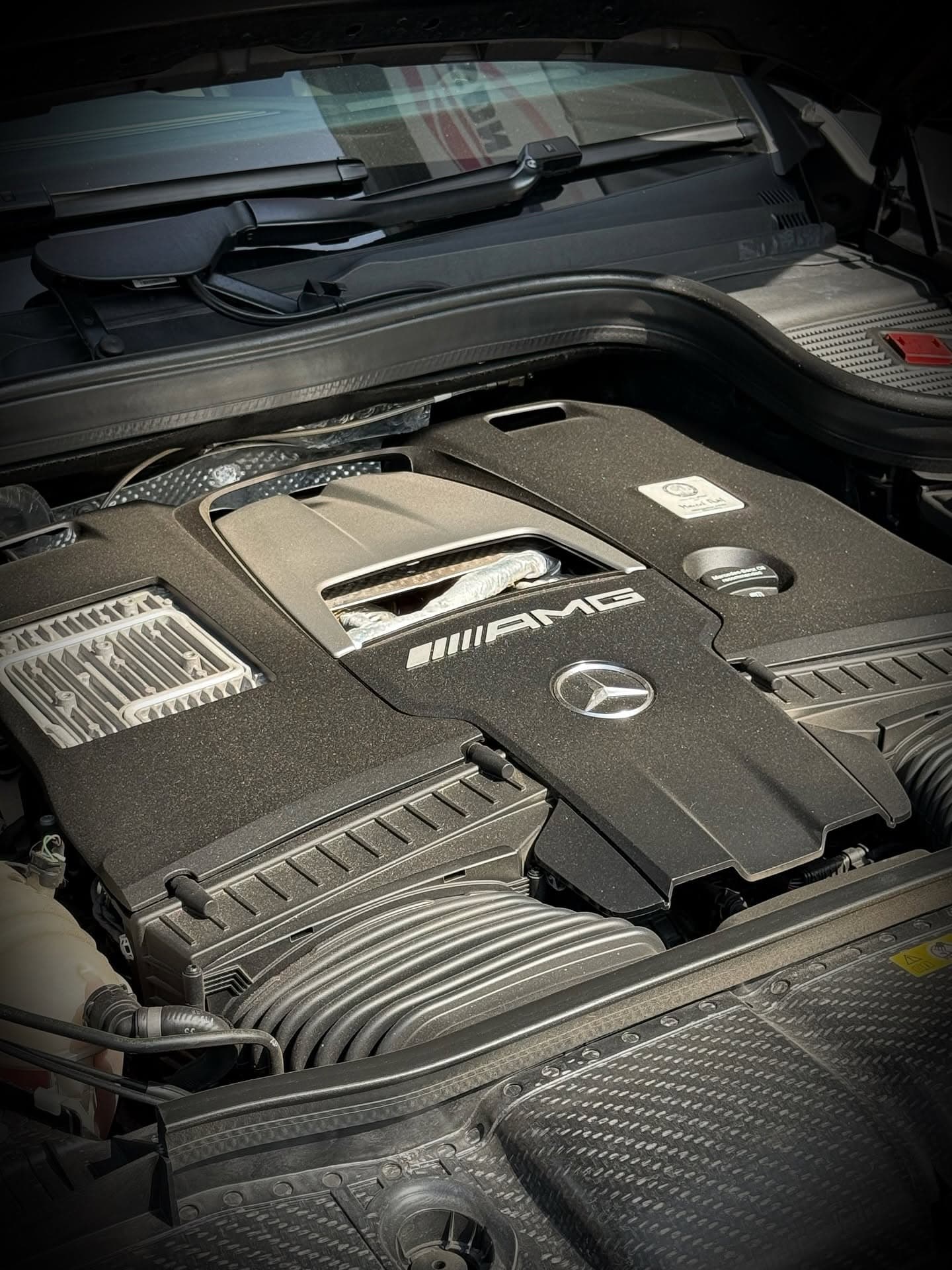 Mercedes-AMG engine bay during vehicle maintenance at Kuala Lumpur workshop